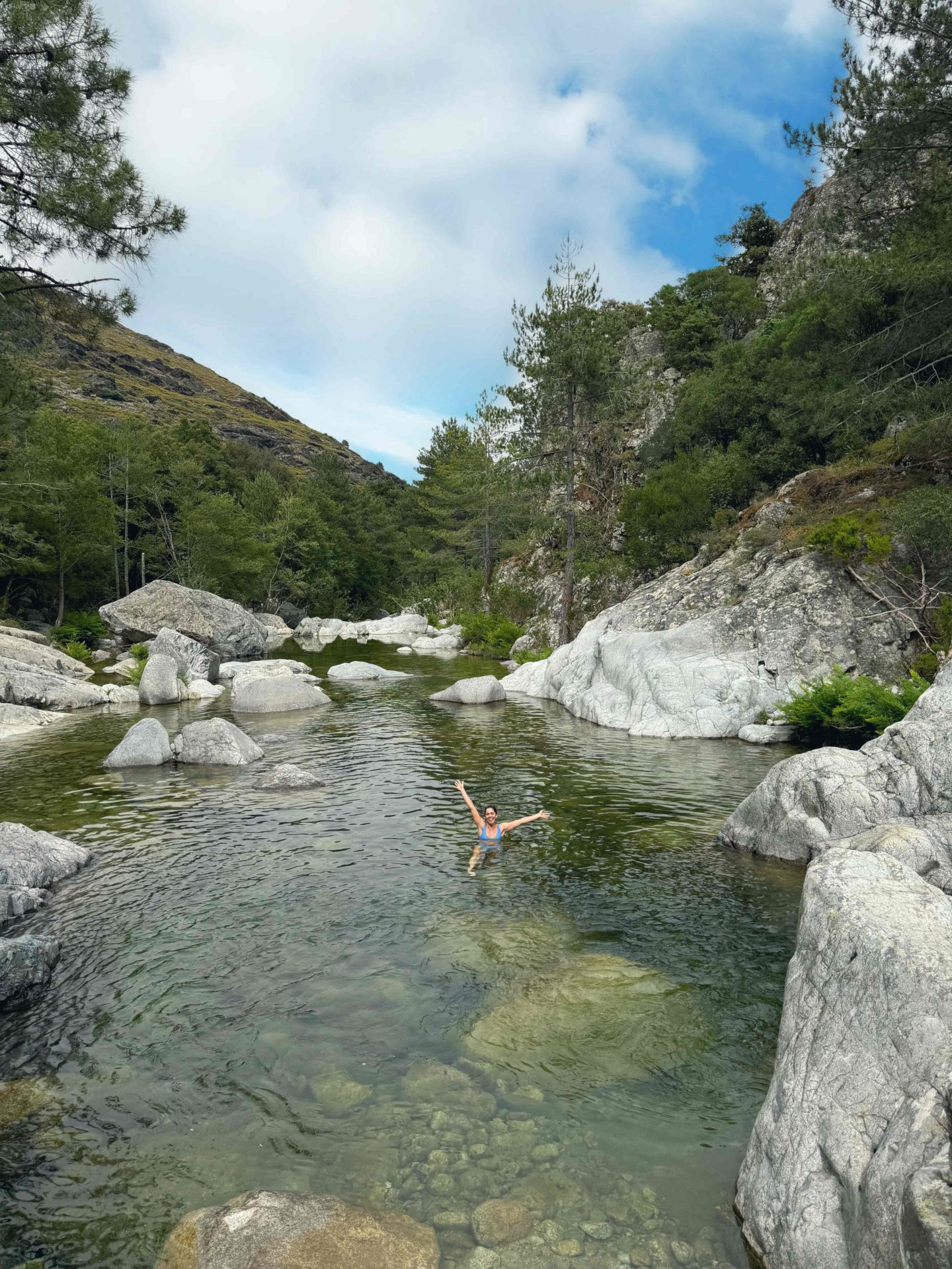 Hazel Wallace (The Food Medic) swims in a river while on a hike in the Corsican mountains