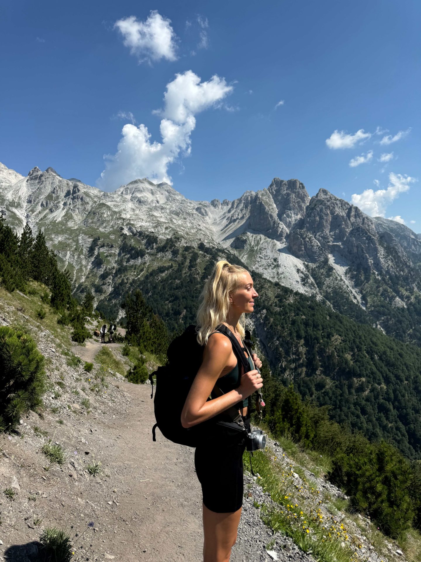 Zanna van Dijk looking out at the view with a backdrop of mountains in Albania