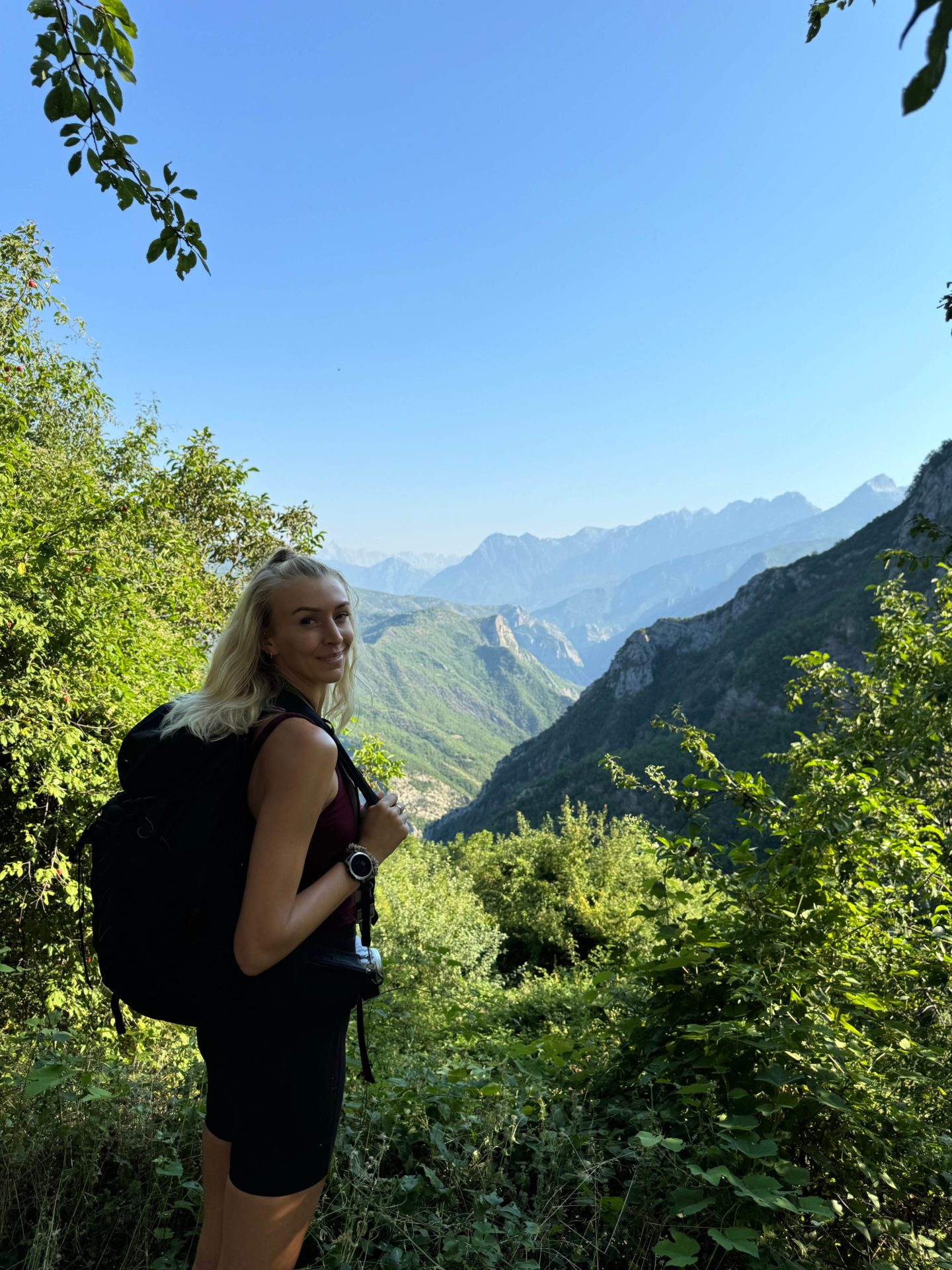 Zanna van Dijk stood in front of a view point on a hike in Albania